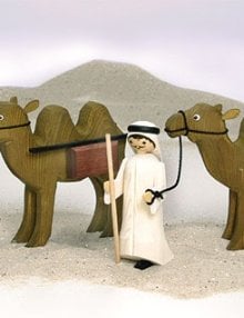 Kameltreiber und Kamel mit Eimer