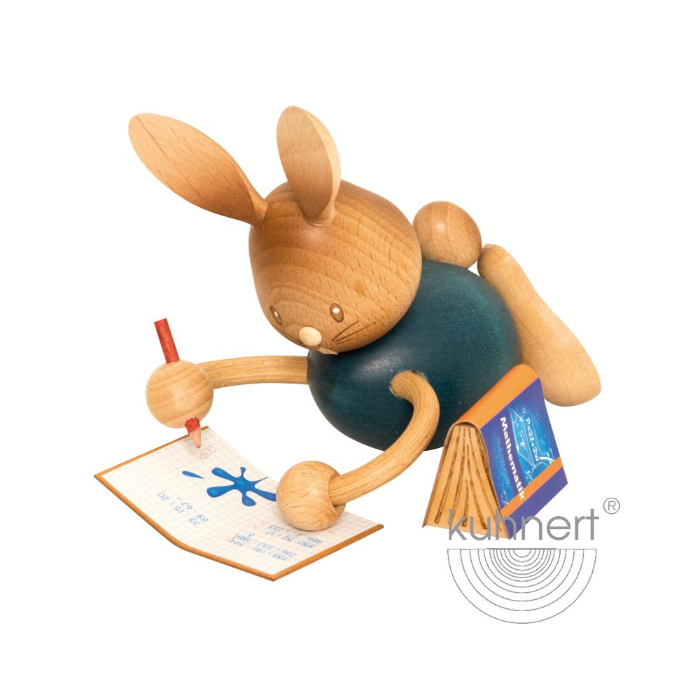 Osterhase Stupsi im Homeschooling, liegend mit Heft