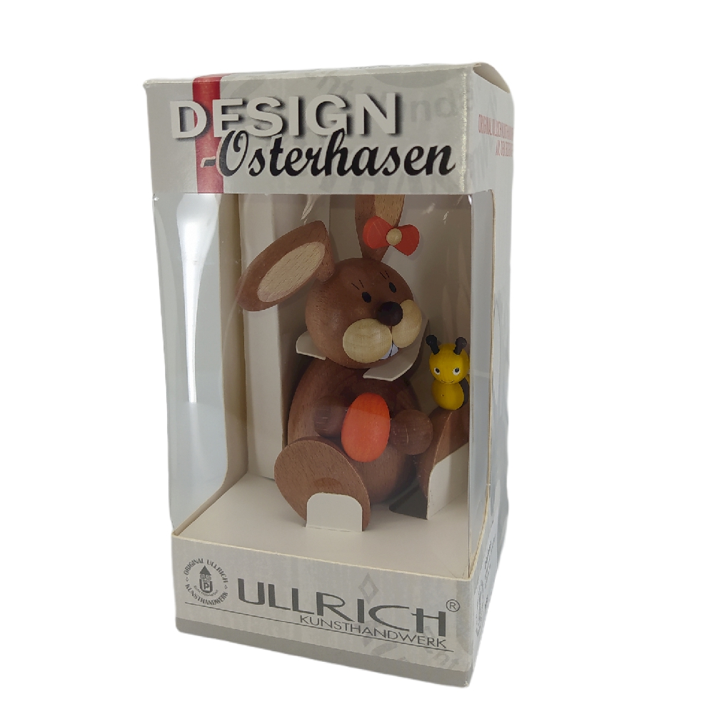 Osterhäsin sitzend mit Ei und Biene