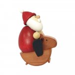 Weihnachtsmann auf Schaukelpferd
