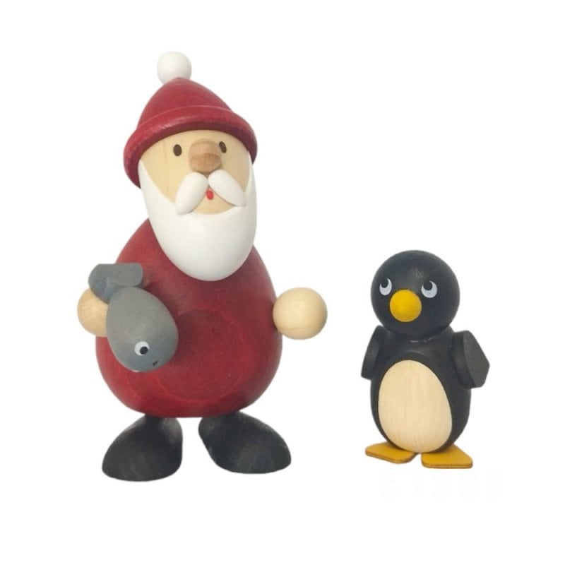 Weihnachtsmann mit Fisch und Pinguin