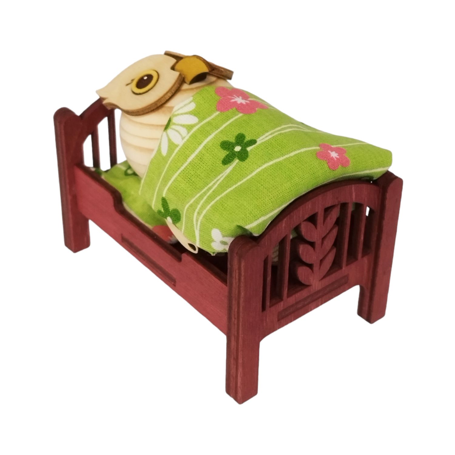 Holzfigur Mini-Eule im Bett