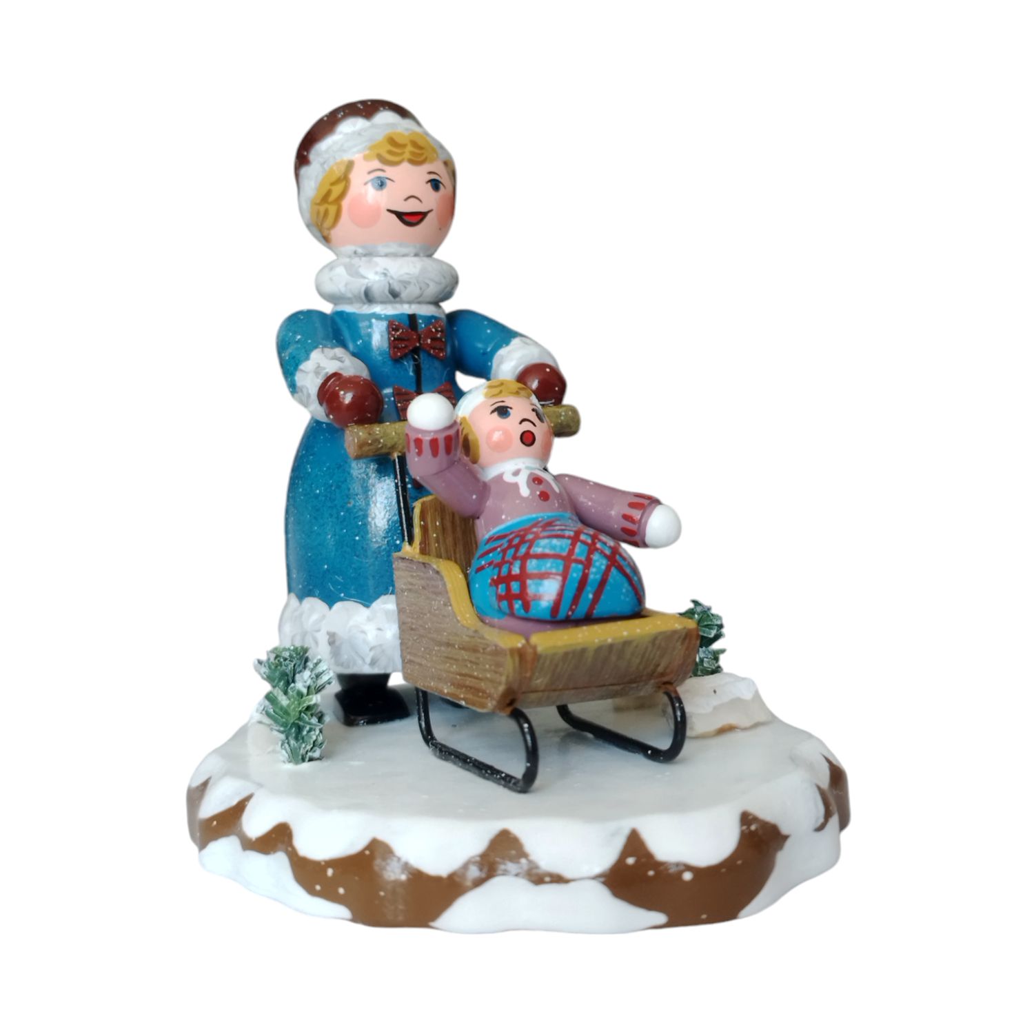 Winterkind - Mädchen mit Kinderschlitten