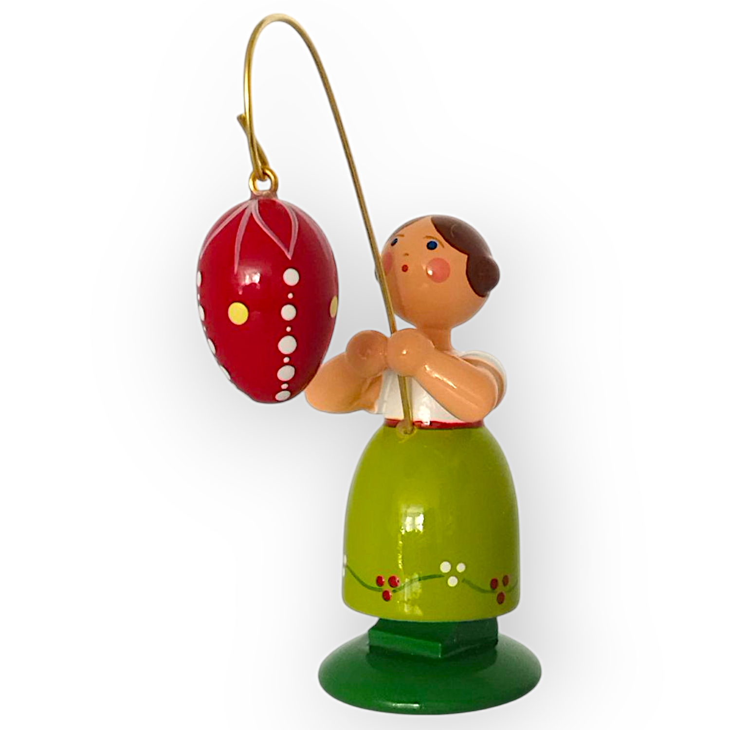 Ostermädchen mit dunkelrotem Ei